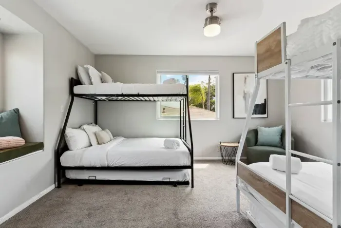 Freshly designed bedroom with calming green accents.