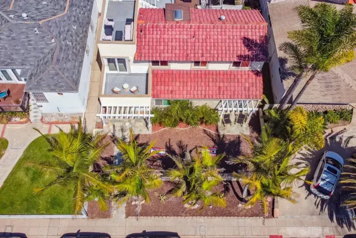 Bird’s-eye view of the property with red tile roof.