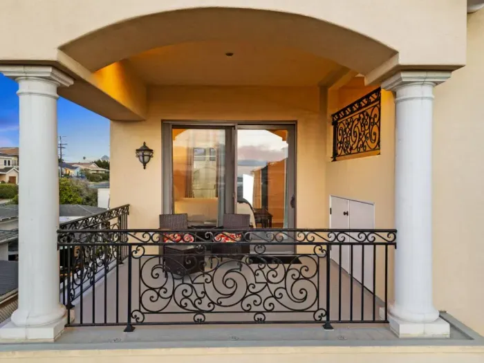Bedroom 1 with a private balcony.