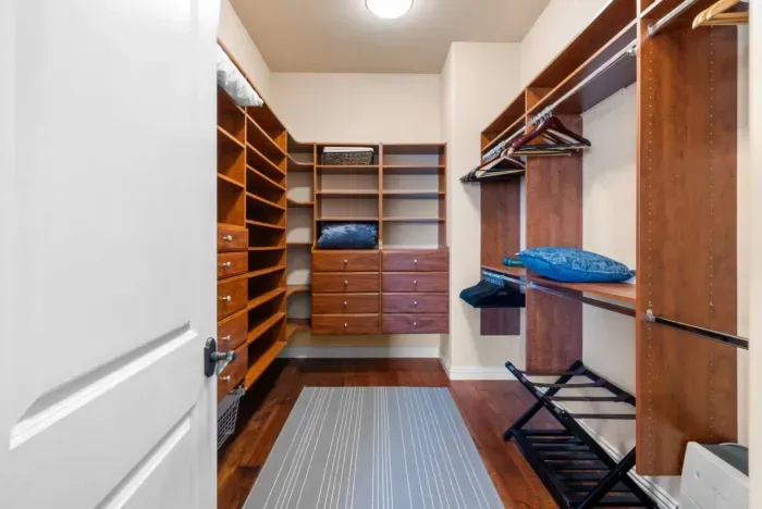 Bedroom 1 with a spacious walk-in closet.