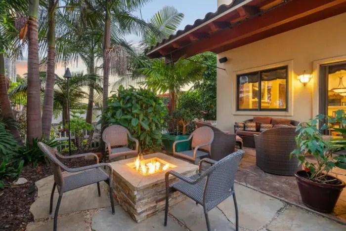 Relaxing backyard with firepit, ideal for hosting.