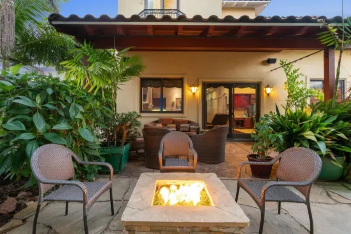 Backyard featuring a cozy fire pit.