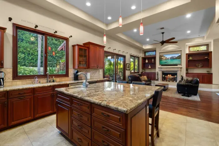 Kitchen conveniently located next to living room.