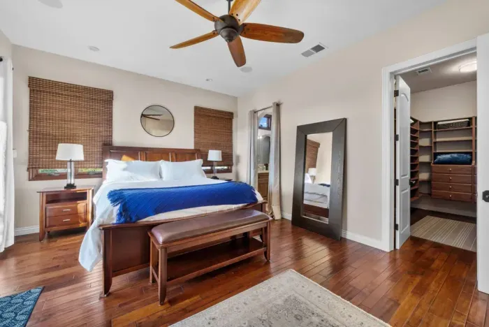 Spacious main bedroom with cozy comfort.