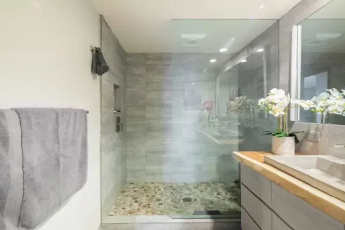 Revitalize with a refreshing shower in our thoughtfully appointed bathroom, offering a revitalizing start or a soothing end to your day.