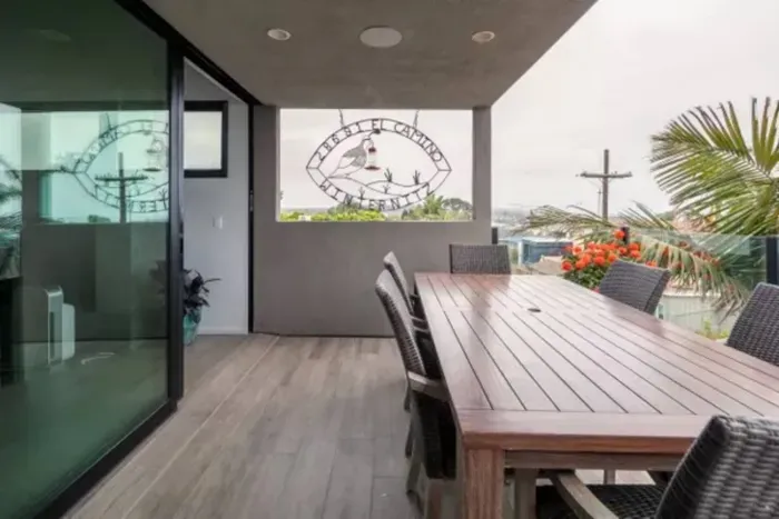 Gather and dine al fresco with ease around our spacious deck table, offering ample room for enjoying meals, drinks, and cherished moments with family and friends against a backdrop of scenic beauty.