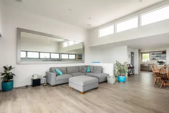 Relax and unwind in our stylish living room adorned with plush, inviting furniture, creating the perfect retreat for your vacation or getaway.