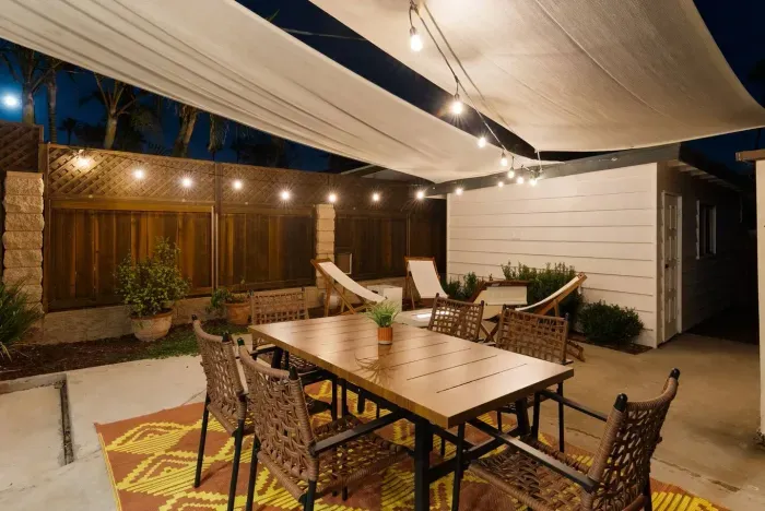 Night patio with soft lights and laughter-ready seating