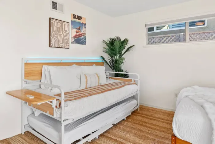 Warm-toned bedding beneath soft LED backlight