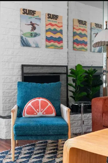 Blue armchair and watermelon pillow