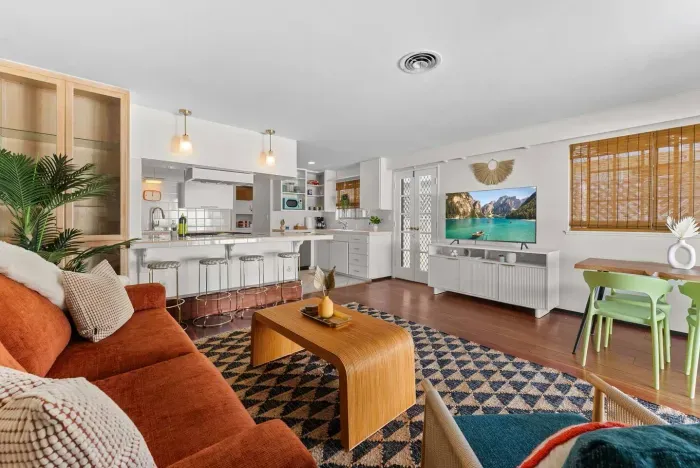 Retro living room with warm tones and patterned rug