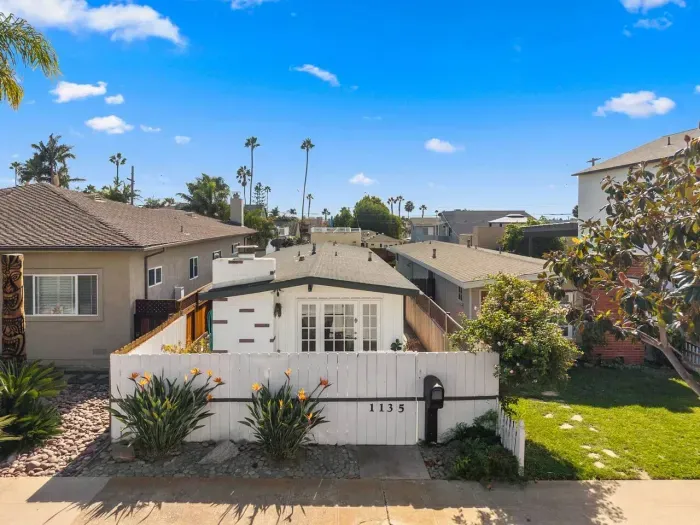 Coastal neighborhood view framed by palms