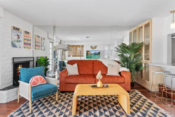Mid-century sofa pops against patterned rug