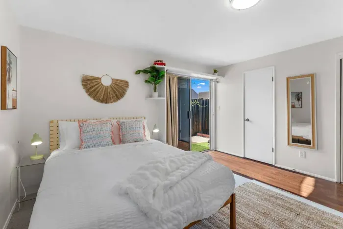 Soft linens and rattan details in the sunlit suite