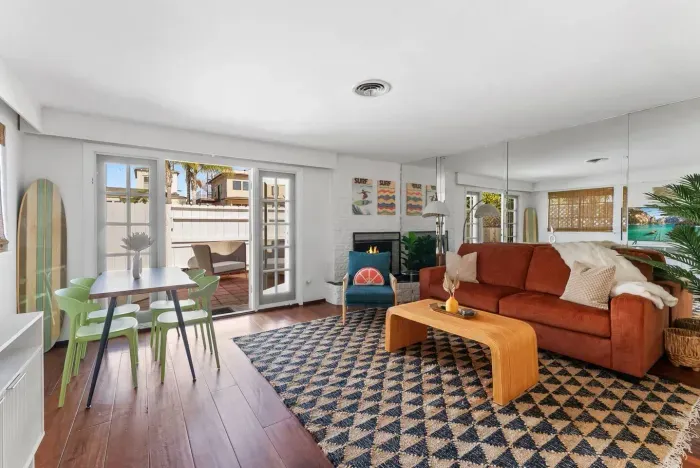 Sunlight pours through glass doors into open lounge