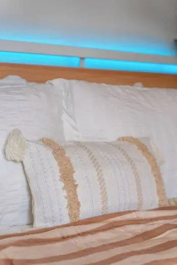 Textured pillows and woven trim add a beachy touch