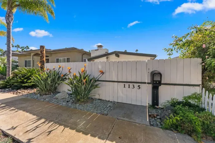 Garden entry framed by agave and sun-washed walls