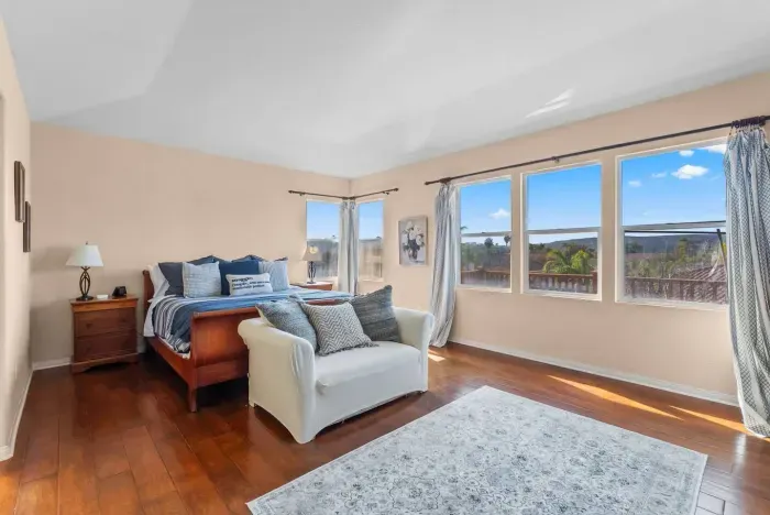 Sunlit room framed by wide windows and blue tones