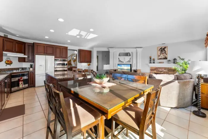 Bright breakfast nook beside the kitchen’s rich wood cabinetry