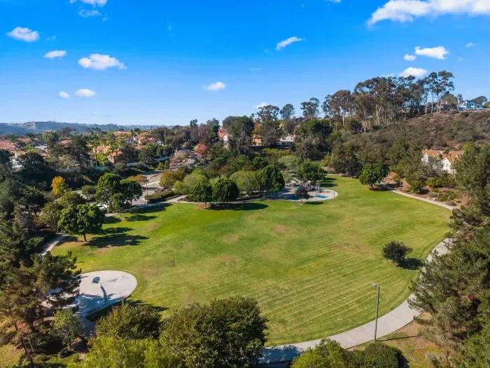Expansive green parkland rolling toward the horizon