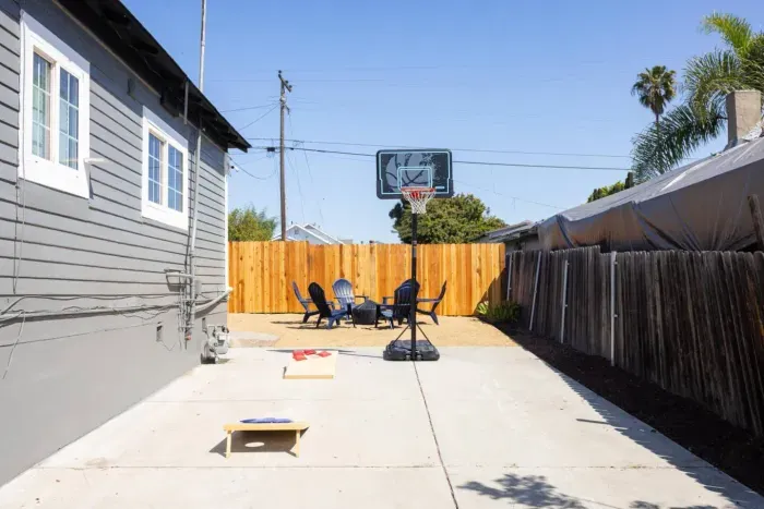 Enjoy basketball and corn hole or park additional cars back here
