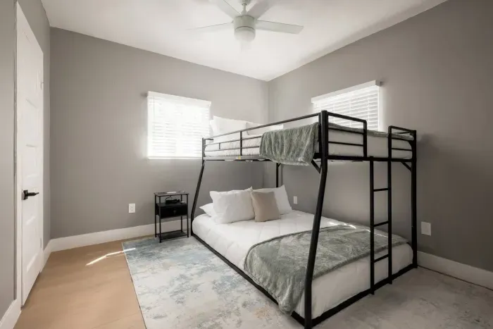 Bedroom with queen on bottom and full on top