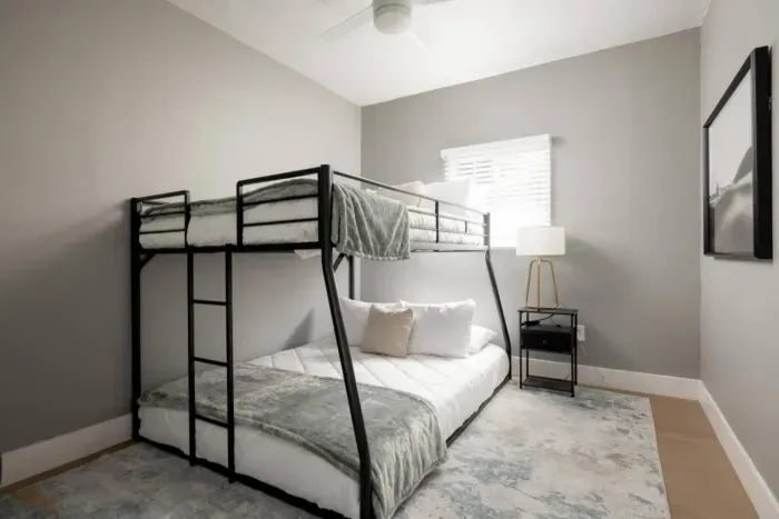 Bedroom with a queen on bottom and full bed on top