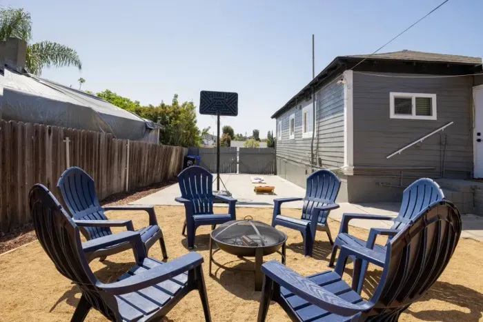Backyard with fire pit and six seats!