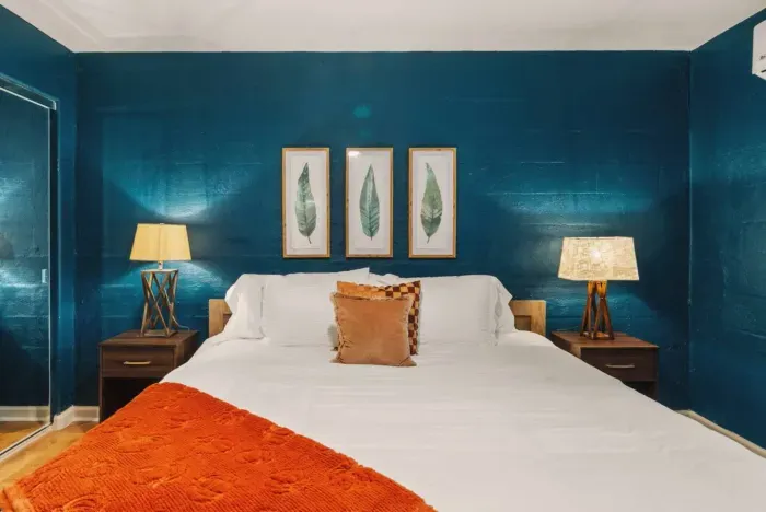 Bedroom 1 with a closet that has floor to ceiling mirrors