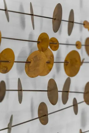 Artful coastal accents —unique wall decor adds modern character to the serene living space.