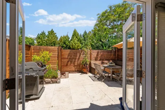 Grill, gather, and unwind in the backyard.