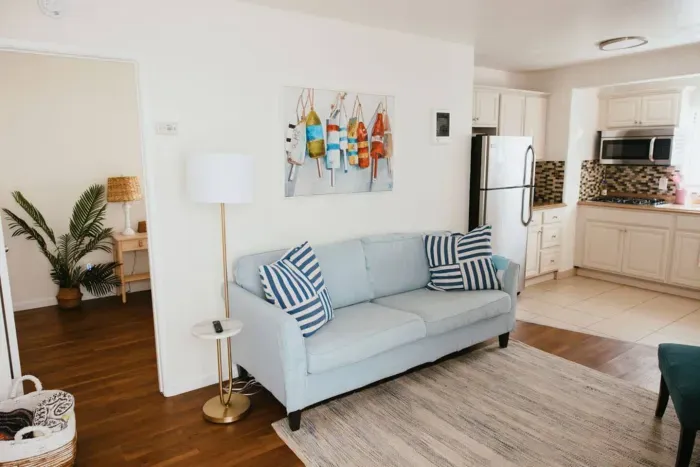 Light-filled living room with comfy seating and coastal touches.