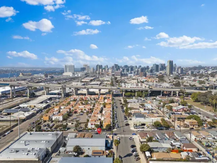 Skyline view of downtown San Diego with a marked property.