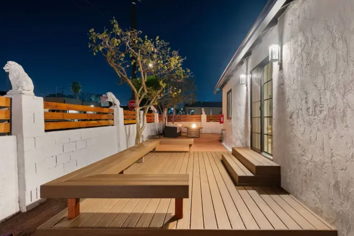 Seamless indoor-outdoor living with a spacious deck, built-in seating, & a cozy fire pit to set the mood!