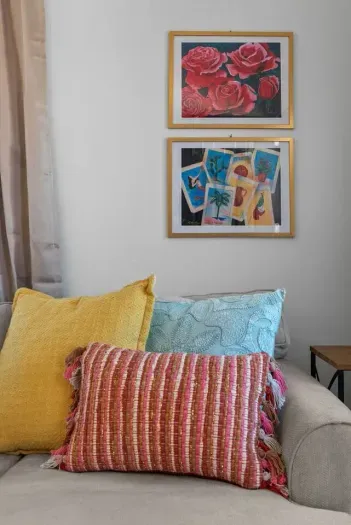 A vibrant and inviting space filled with rich textures, bold artwork, and cozy accents.