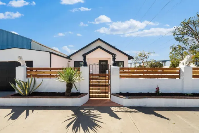 A stylish urban retreat with a gated entrance and inviting outdoor space.