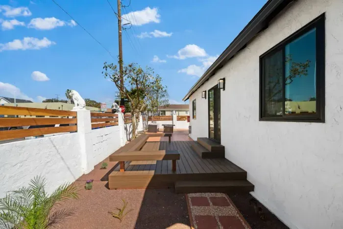 Stylish outdoor deck with built-in seating, perfect for relaxation!