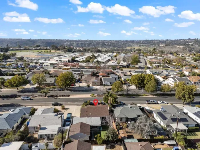 Aerial view of a suburban house marked with a pin.