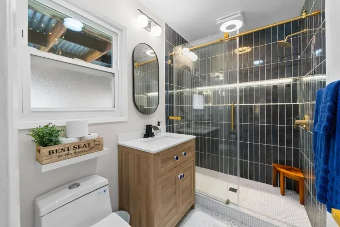 Elegant bathroom with gold accents and a luxurious walk-in shower!
