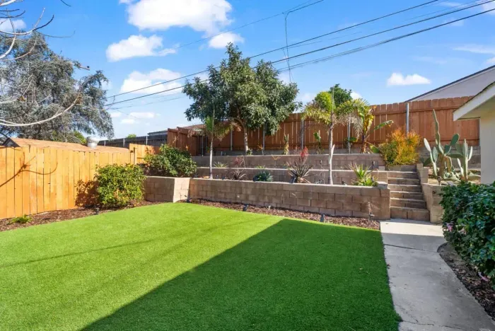 Relax in this lush, sun-filled backyard oasis!