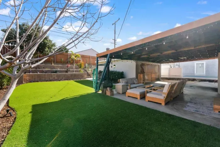 Relax in your private backyard oasis with cozy seating and a fire pit!