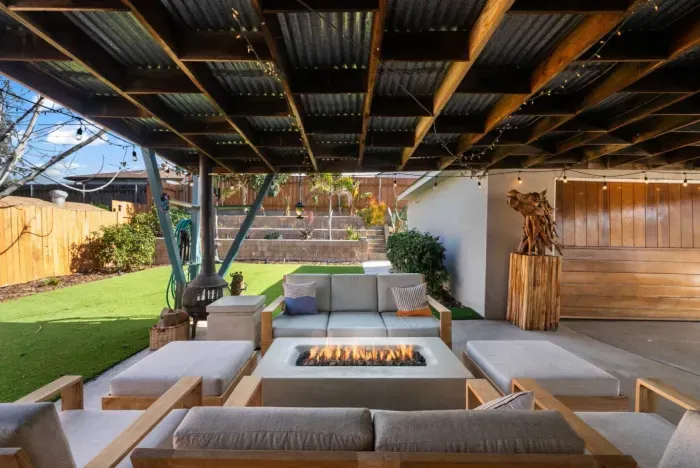 Relax and unwind by the fire in this stylish outdoor retreat!