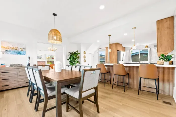 Dining area with seating for gatherings and natural light.
