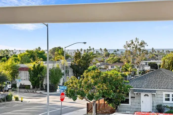 View overlooking the neighborhood and treetops.