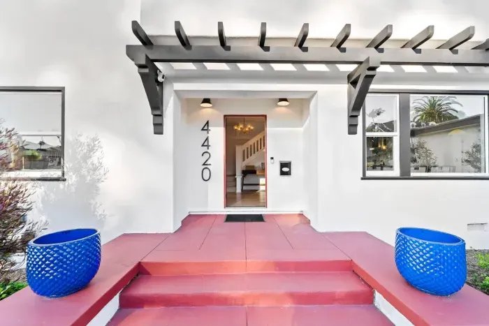 Welcoming front entry with bold steps and stylish awning.