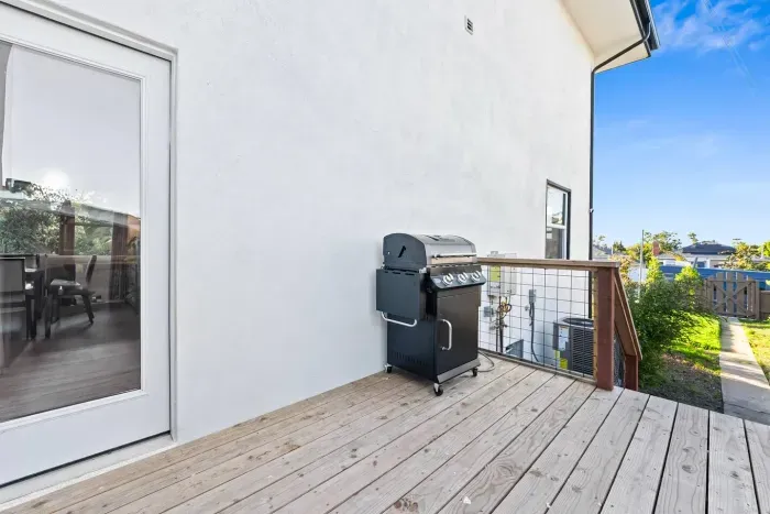 Outdoor deck space with grill for easy cooking.