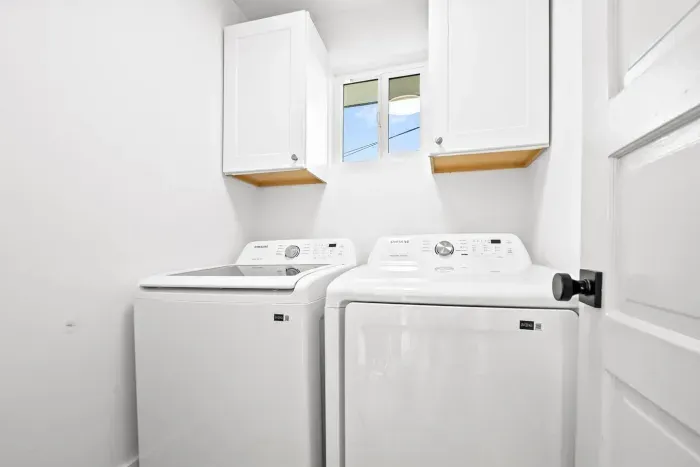 Laundry area with full-size washer and dryer.
