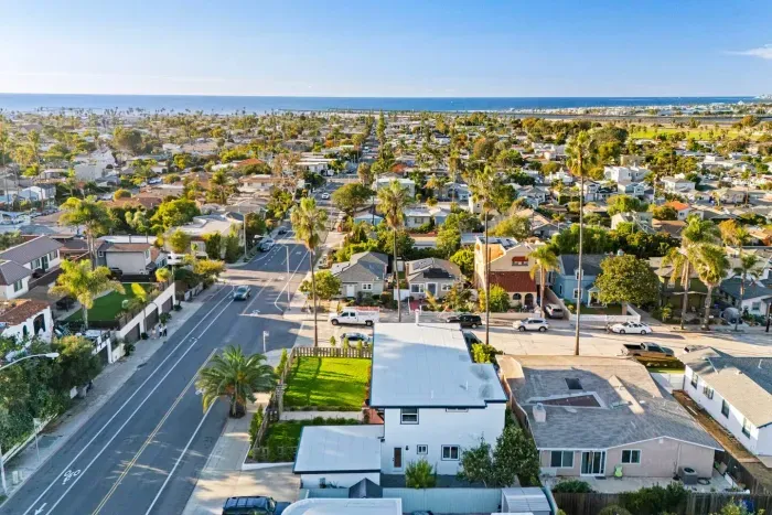 Coastal neighborhood view with open skies and surrounding homes.