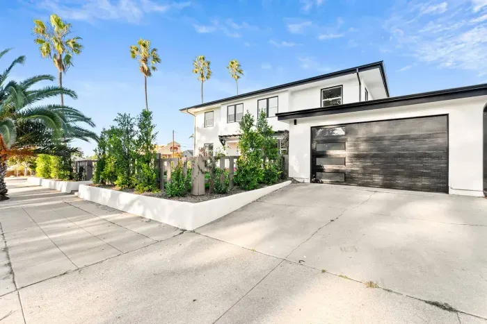 Modern exterior with clean lines and spacious driveway.