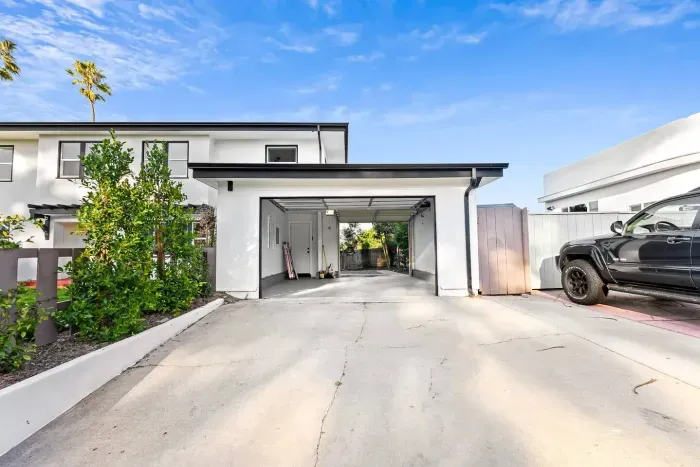Garage and driveway offering easy parking access.
